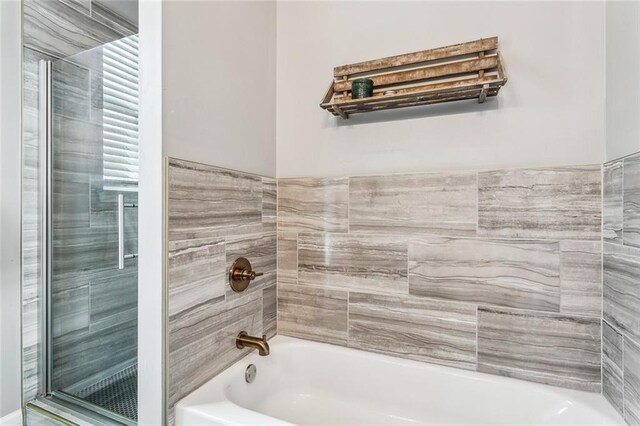 bathroom featuring  shower combination