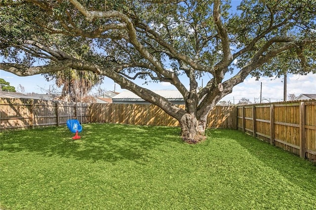 view of yard with a fenced backyard