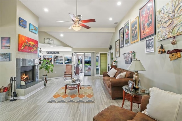 living room with lofted ceiling, ceiling fan, recessed lighting, wood finished floors, and a high end fireplace