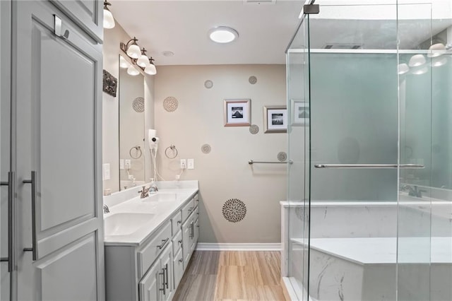 full bathroom featuring a stall shower, visible vents, a sink, and double vanity