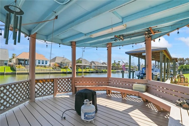 deck with a water view and a residential view