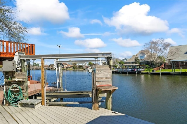 dock area featuring a water view and boat lift