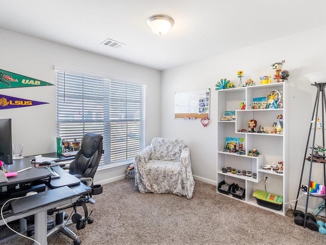 office with carpet flooring, visible vents, and baseboards