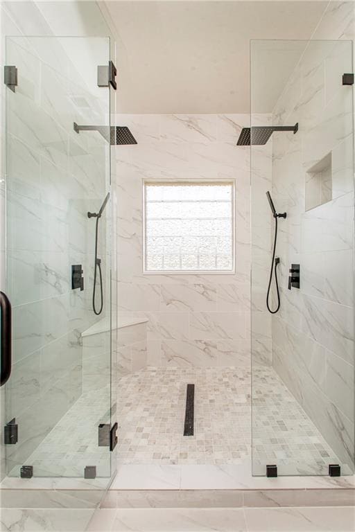 bathroom with a shower stall