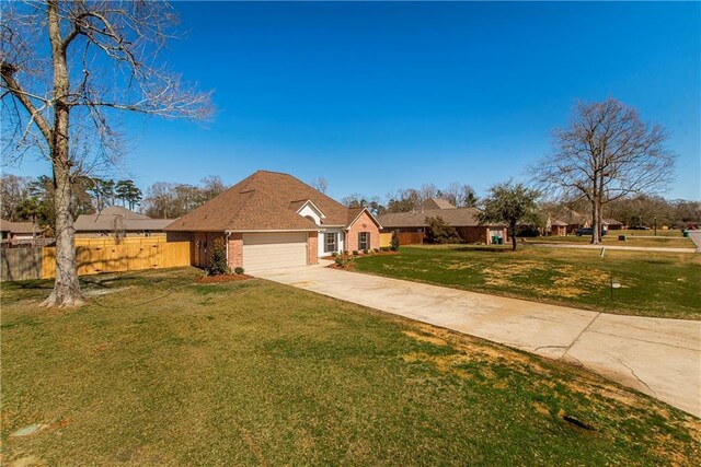 view of front of house with a garage, brick siding, fence, concrete driveway, and a front lawn