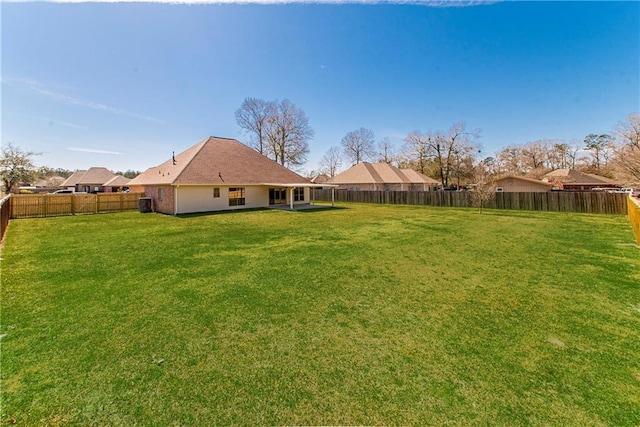 view of yard featuring a fenced backyard