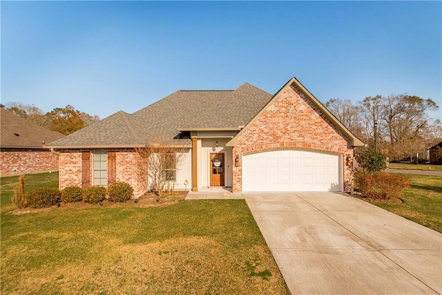 view of front facade featuring concrete driveway, a front lawn, an attached garage, and brick siding