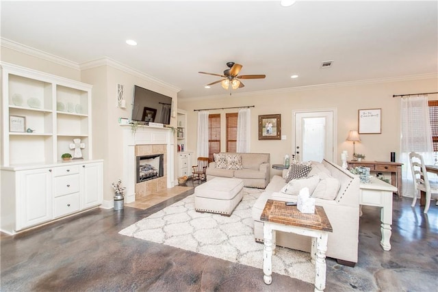 living room with a fireplace, recessed lighting, visible vents, ornamental molding, and ceiling fan