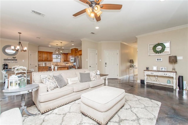 living area featuring ornamental molding, visible vents, baseboards, and ceiling fan with notable chandelier