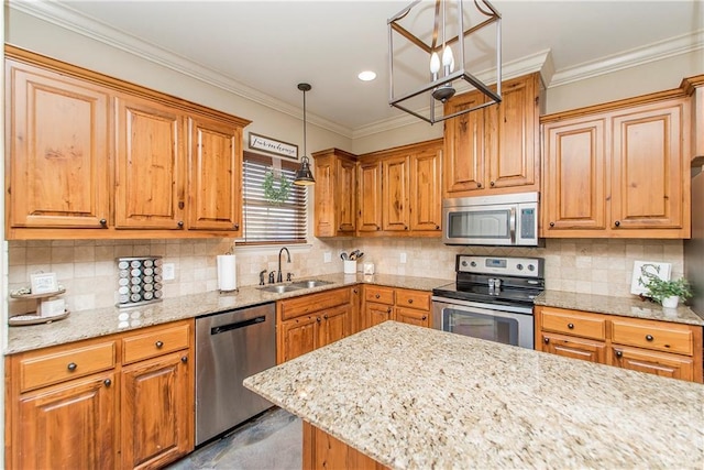 kitchen featuring light stone counters, crown molding, tasteful backsplash, appliances with stainless steel finishes, and a sink