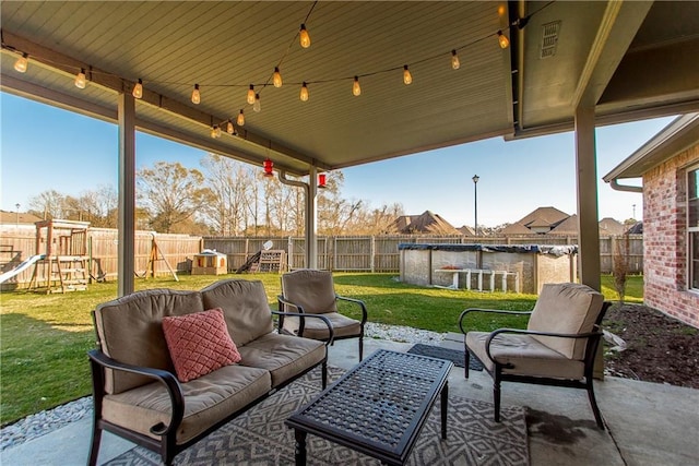 view of patio featuring a fenced backyard, a fenced in pool, an outdoor living space, and a playground