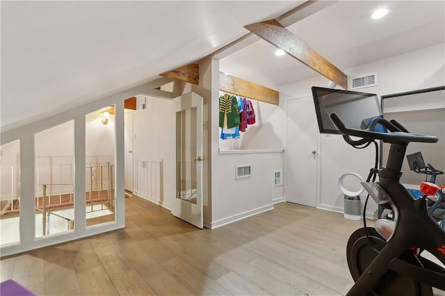 exercise room with light wood-type flooring, visible vents, and recessed lighting