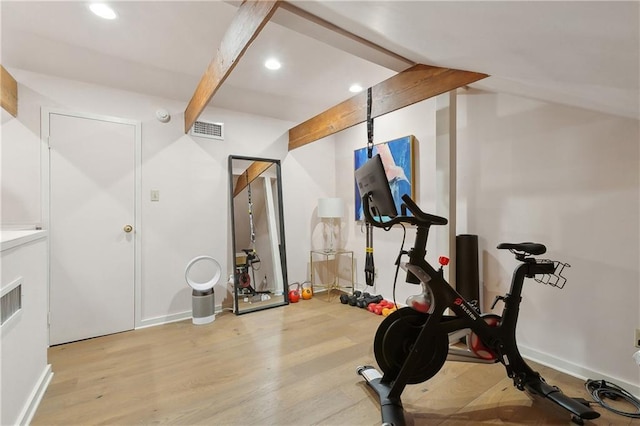 exercise room with baseboards, visible vents, wood finished floors, vaulted ceiling, and recessed lighting