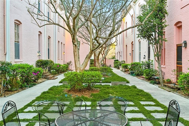 view of property's community with outdoor dining space