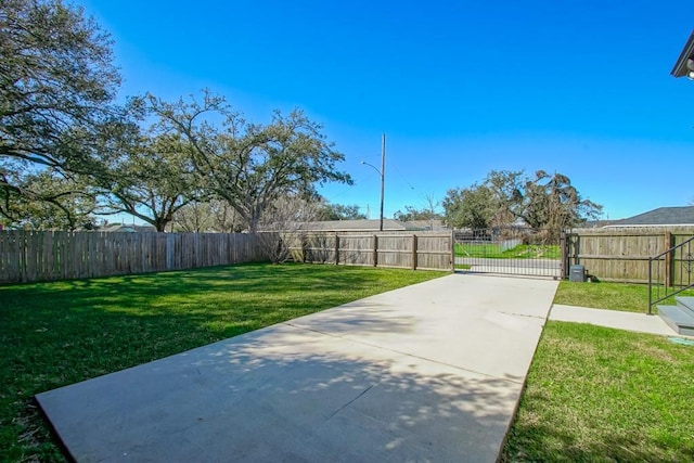 view of property's community featuring a fenced backyard, a gate, and a yard