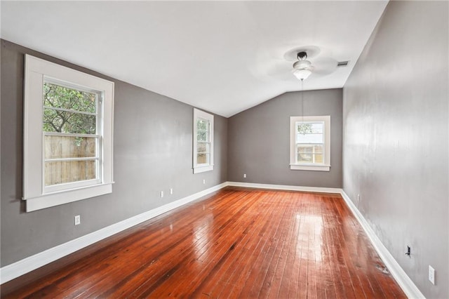 bonus room with vaulted ceiling, ceiling fan, wood-type flooring, and baseboards