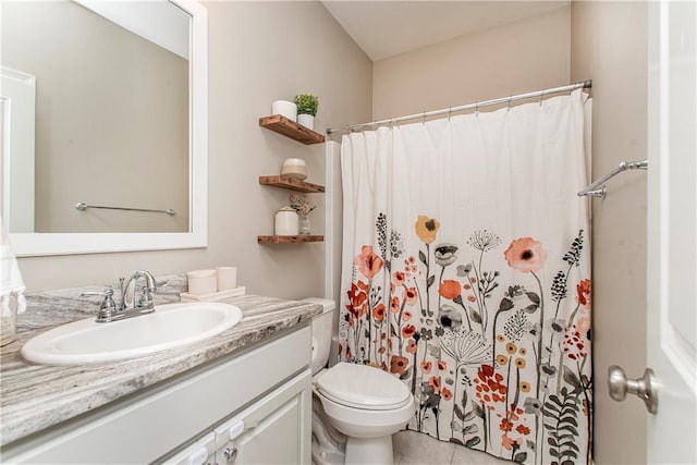 bathroom featuring toilet, tile patterned floors, a shower with curtain, and vanity