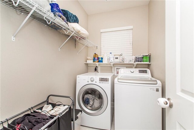 clothes washing area with laundry area and washing machine and dryer