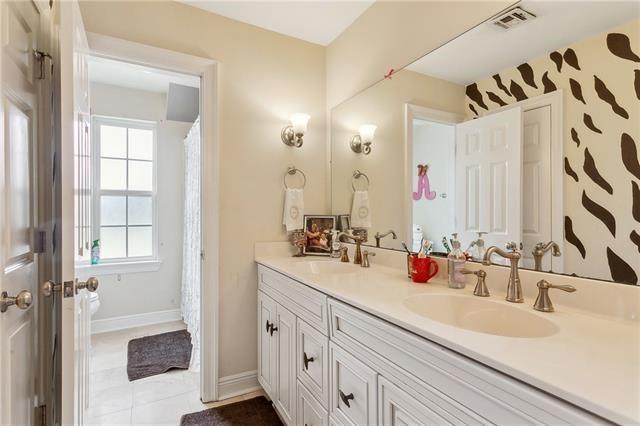 4701 Lake Vista Dr, Metairie, LA 70006 - full bath with double vanity and tile patterned floors