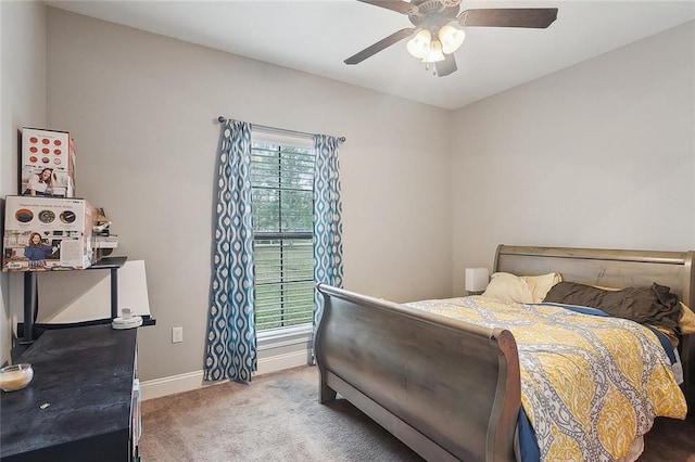 bedroom featuring carpet, baseboards, and a ceiling fan