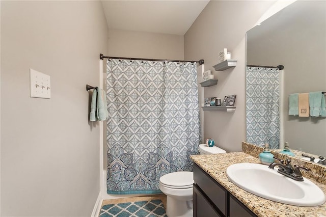 full bathroom with vanity and toilet