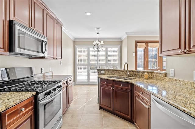 kitchen featuring light tile patterned floors, visible vents, appliances with stainless steel finishes, ornamental molding, and a sink