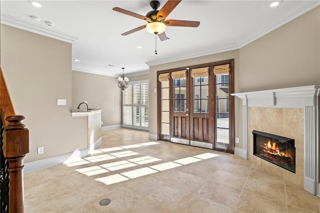 unfurnished living room with crown molding, recessed lighting, a fireplace, and baseboards