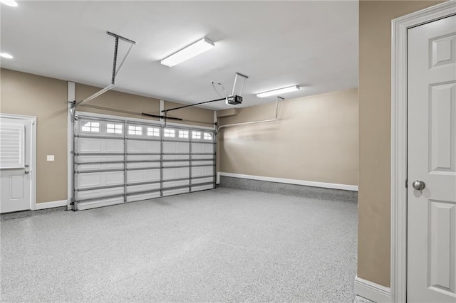 garage featuring baseboards and a garage door opener