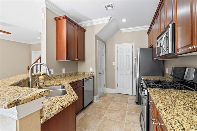 kitchen featuring light stone counters, a peninsula, a sink, appliances with stainless steel finishes, and crown molding