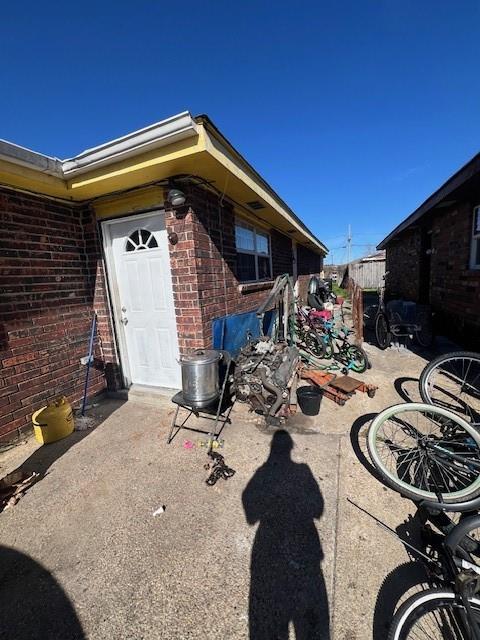 exterior space with brick siding