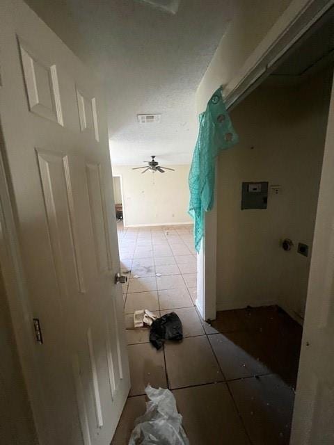 hallway with light tile patterned floors