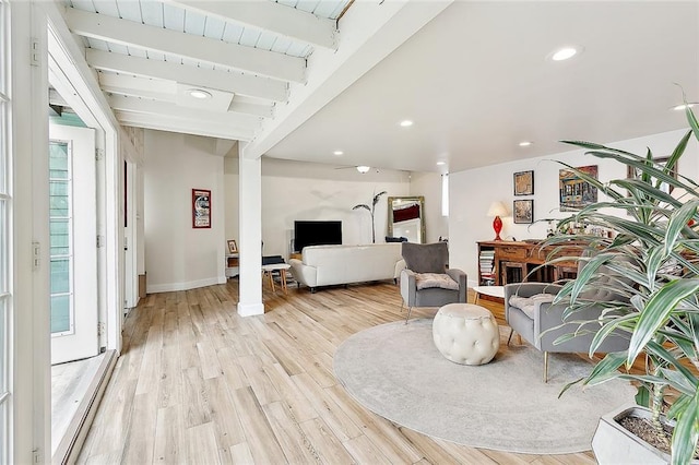 interior space featuring light wood-style floors, recessed lighting, beam ceiling, and baseboards