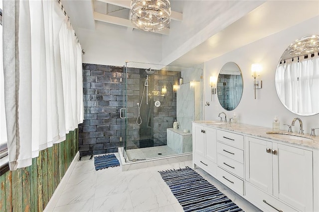 bathroom featuring double vanity, marble finish floor, a shower stall, and a sink