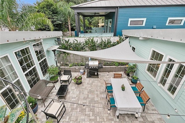 view of patio / terrace featuring ceiling fan, outdoor dining space, area for grilling, and fence