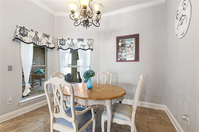 dining area with ornamental molding, a notable chandelier, and baseboards