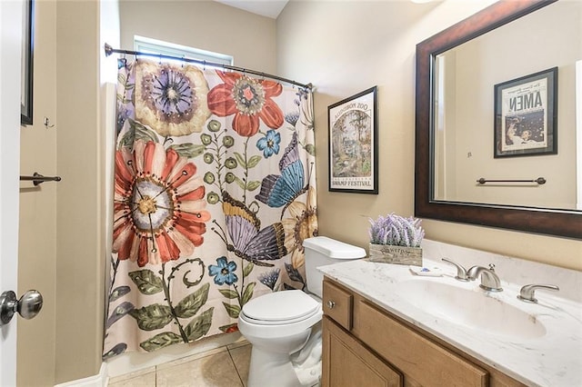 bathroom featuring curtained shower, vanity, toilet, and tile patterned floors