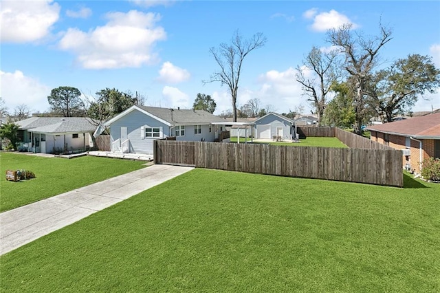 exterior space with a front yard, a residential view, and fence