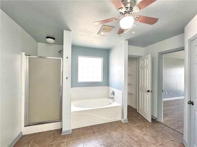 bathroom featuring a stall shower, visible vents, a garden tub, and tile patterned floors