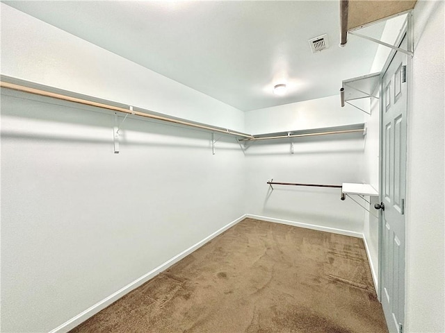 spacious closet featuring carpet floors and visible vents