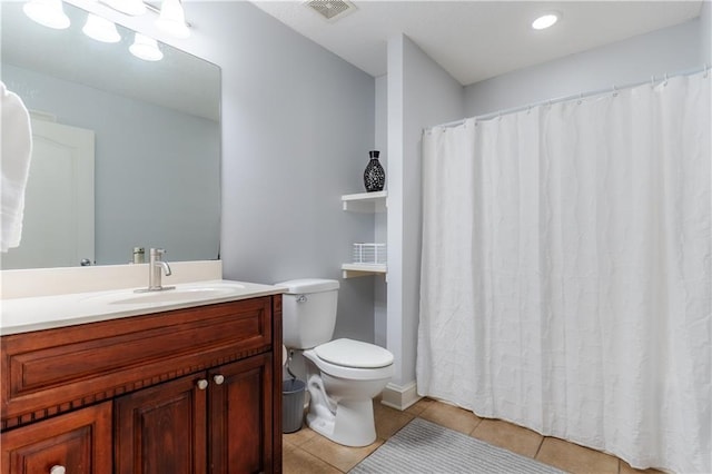 full bathroom featuring tile patterned flooring, toilet, a shower with shower curtain, vanity, and visible vents