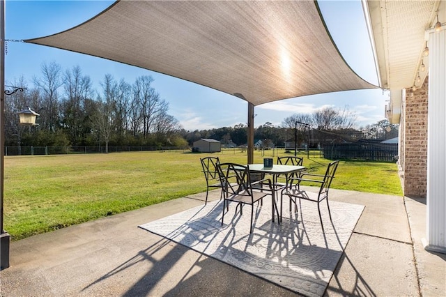 view of patio with outdoor dining area and a fenced backyard