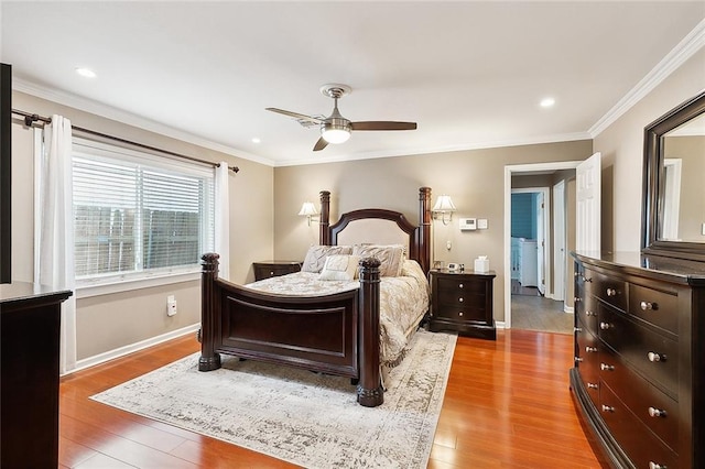 bedroom with ornamental molding, a ceiling fan, and wood finished floors