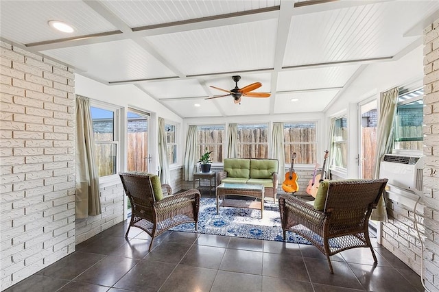 sunroom / solarium featuring cooling unit, vaulted ceiling with beams, and ceiling fan