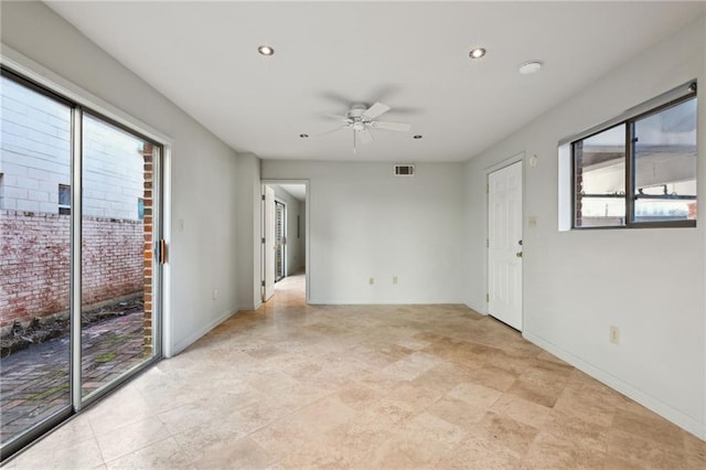 spare room with a ceiling fan, recessed lighting, visible vents, and baseboards