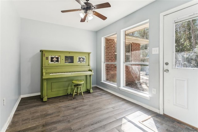 340 Colonial Ct, Mandeville, LA 70471 - sitting room with dark wood-style floors, ceiling fan, and baseboards