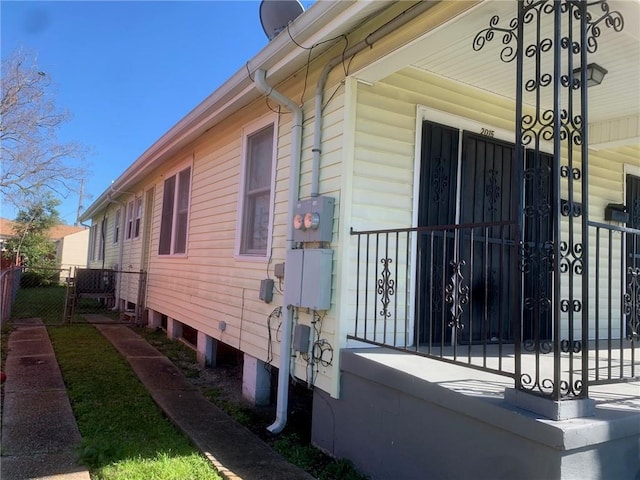 view of side of home with fence