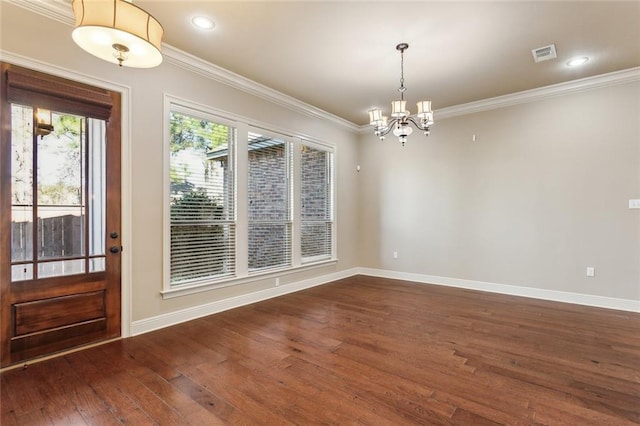 unfurnished dining area with dark wood-style floors, visible vents, ornamental molding, and baseboards