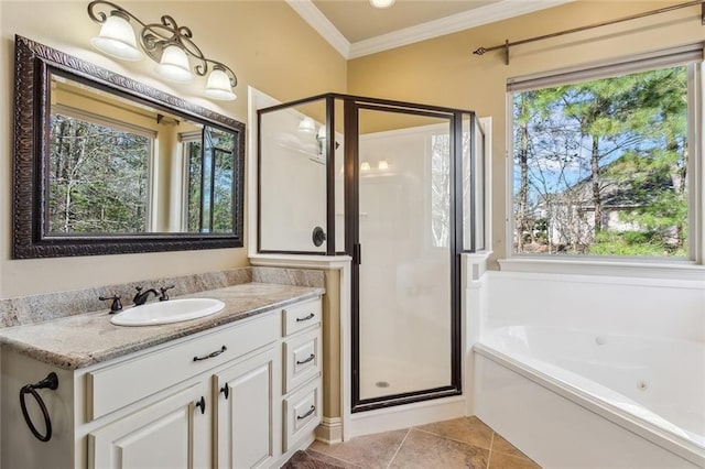 full bath with tile patterned flooring, vanity, ornamental molding, a jetted tub, and a stall shower