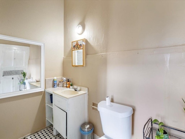 bathroom featuring vanity and toilet