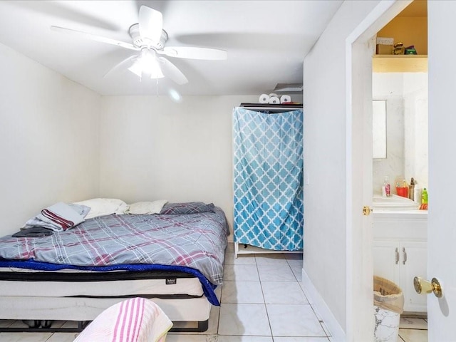 tiled bedroom with a ceiling fan